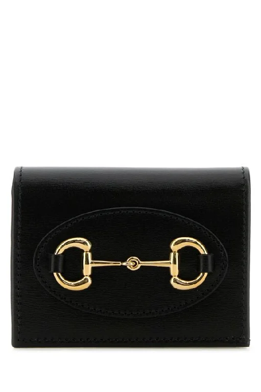 Women Gucci Sylvie bags with a monogram - embossed leatherGucci Woman Black Leather Horsebit 1955 Wallet