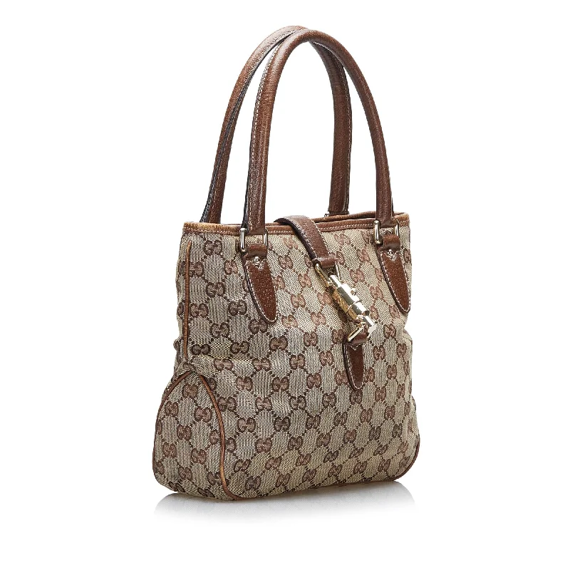 Women Gucci bags with a snap - button closure and a decorative charmGucci GG Canvas Jackie Piston Lock Handbag (SHG-oonzW2)