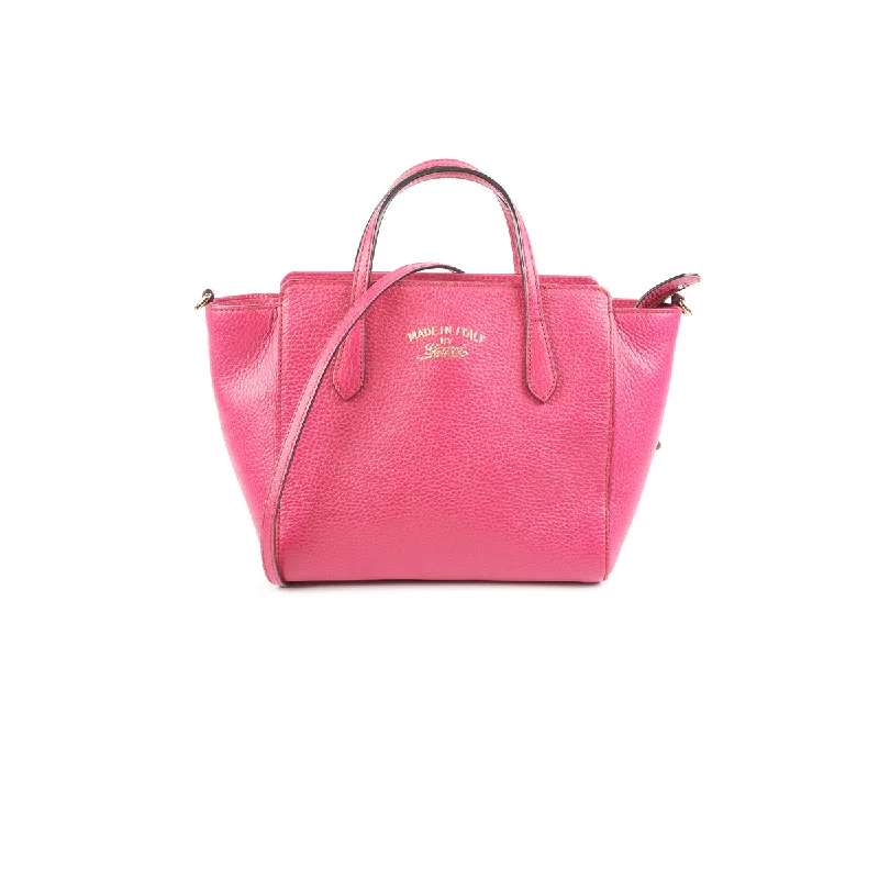 Women Gucci bags with a snap - button closure and a decorative charmGucci Swing Pink