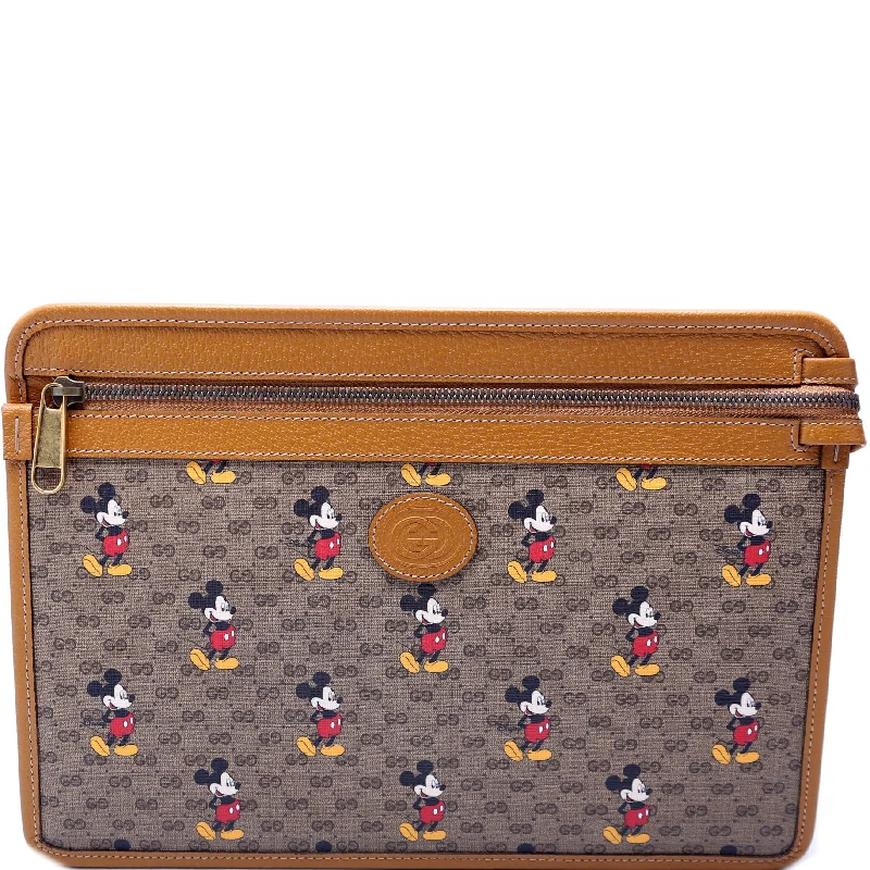 Women Gucci bags with interlocking G hardware for a classic lookGucci X Disney GG Supreme Mickey Mouse Zip Pouch