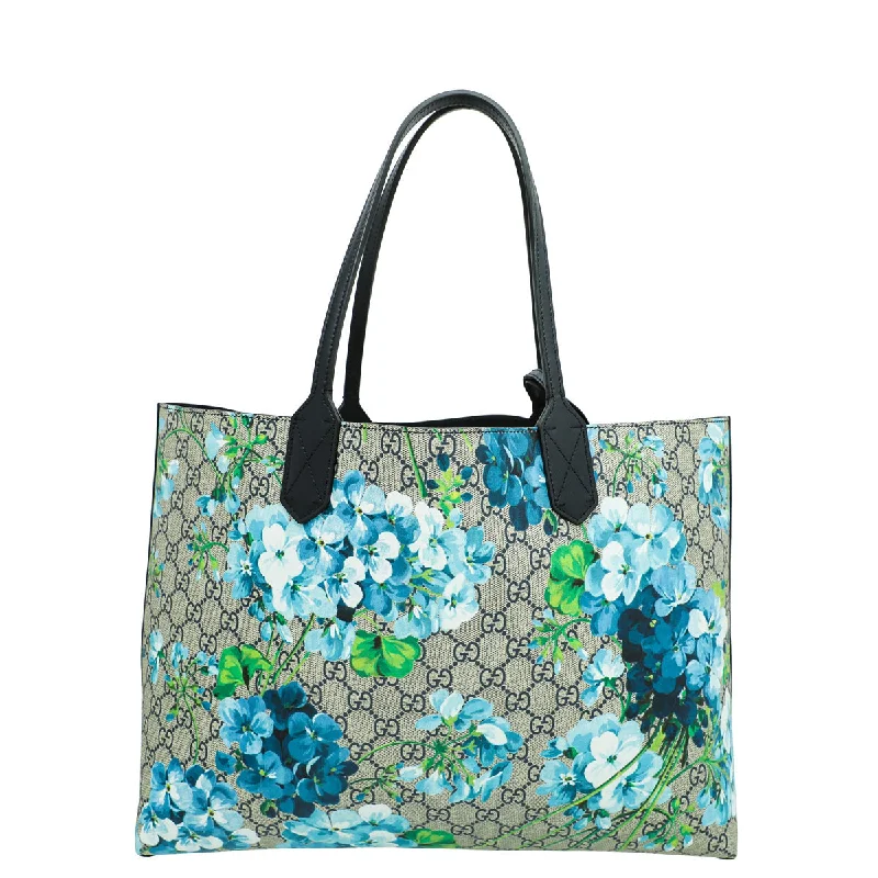 Women Gucci bags with a zippered interior pocketGucci Bicolor GG Supreme Blooms Medium Reversible Tote Medium Bag