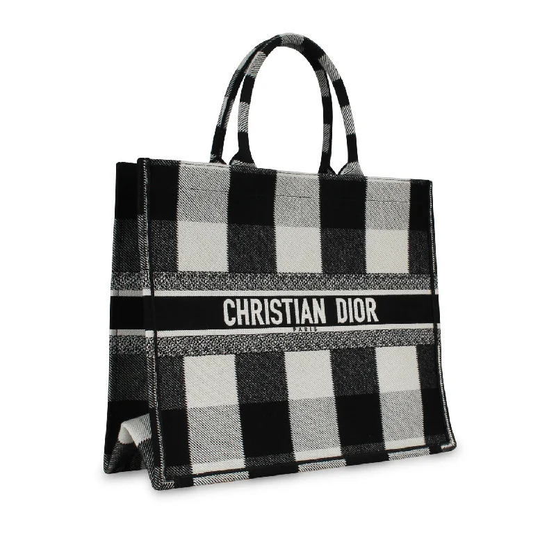 Christian Dior tote bags with a printed Dior logo on the frontDior Book Tote