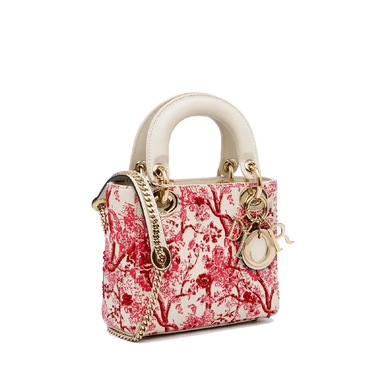 Christian Dior Saddle bags with a distressed leather finishDior Mini Floral Toile de Jouy Lady Dior