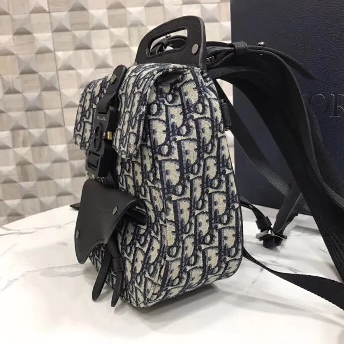 Christian Dior backpacks with a sleek, minimalist silhouetteDior Mini Saddle Backpack In Blue Oblique Jacquard