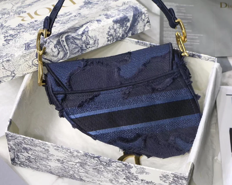 Christian Dior handbags with a snap - button closure and a decorative buckleDior Saddle Bag In Blue Camouflage Canvas