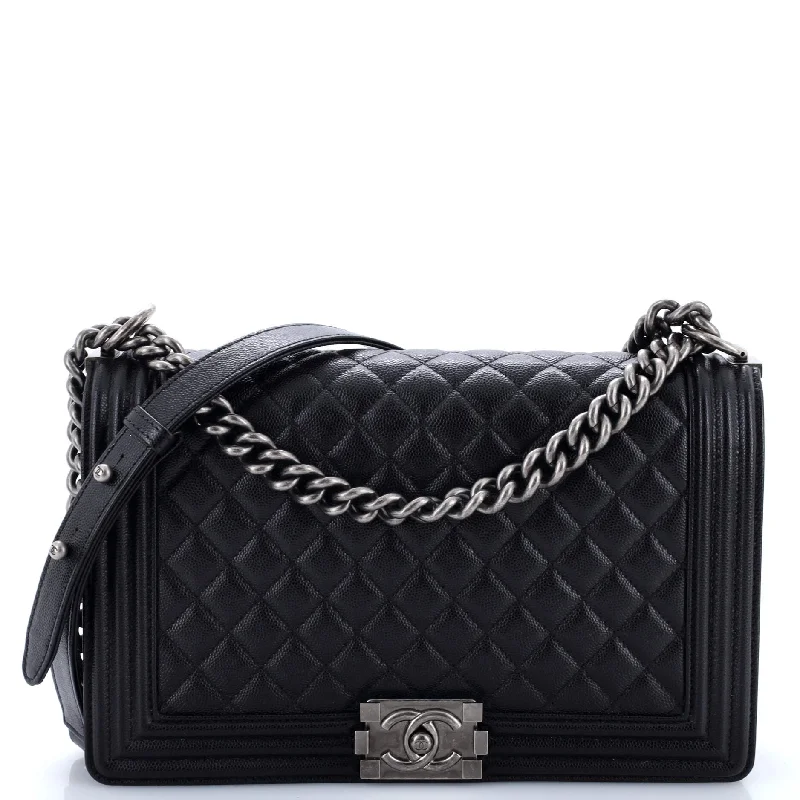 Christian Dior handbags with a snap - button closure and a decorative buckleBoy Flap Bag Quilted Caviar New Medium