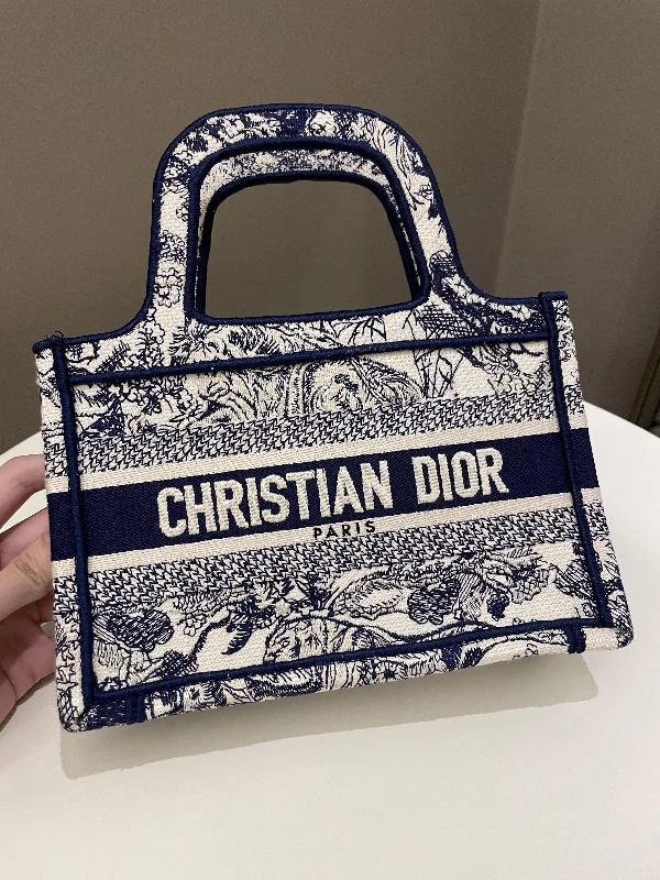 Christian Dior tote bags with a printed Dior logo on the frontDior Mini Book Tote Blue